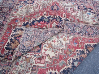 antique heriz serapi rug measuring 9' 5" x 11' 3" great design and colors has wear but solid rug very floppy  both ends and sides are good no holes clean rug  ...