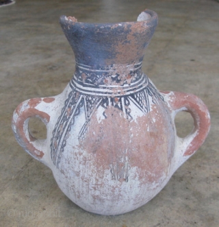 Berber terracotta vase with two lug handles and a flat base, Morocco, 19thC, the designs are thought to derive from body tattoos, orange paste with grog temper of crushed pottery, white clay  ...