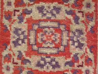 Semi-antique rug, hand knotted wool, Chinese Turkestan, Xinjiang Provence, either Khotan or Yarkand rug, mid 20thC, orange and purple, small square mats like this were probably seating mats, the approximate size is  ...