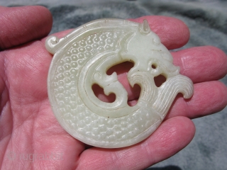 Vintage Chinese jade disc, hand carved water dragon, also called a dragon fish, king of all fishes, pale celadon, general good condition, the approximate size at the widest point is 3 inches  ...