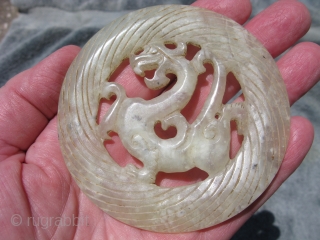 Vintage Chinese jade disc, hand carved foliate dragon, pale celadon, hairline crack but stable, the approximate size is 3.5 inches across, shipping is extra         