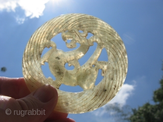 Vintage Chinese jade disc, hand carved foliate dragon, pale celadon, hairline crack but stable, the approximate size is 3.5 inches across, shipping is extra         