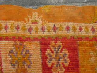 Semi-Antique Moroccan rug, hand knotted wool, ca 1950's, orange and red with pale purple, green, yellow, I love the square central medallion surrounded by animals that look like camels to me, Worn  ...