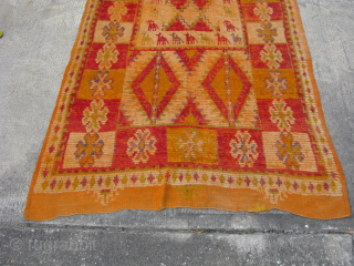 Semi-Antique Moroccan rug, hand knotted wool, ca 1950's, orange and red with pale purple, green, yellow, I love the square central medallion surrounded by animals that look like camels to me, Worn  ...