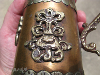 Vintage Tibetan pitcher, hand crafted copper and silver colored metal, 7 applied water dragons and a dragon as a handle, signs of use on the inside, some tarnish, corrosion to the bottom,  ...