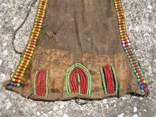 Old African modesty apron, cache sexe, for a young girl, Turkana People of Kenya, hand embroidered glass beads on hide, sinew sewn and sewn with hide strips, soiling, stiffness of hide due  ...