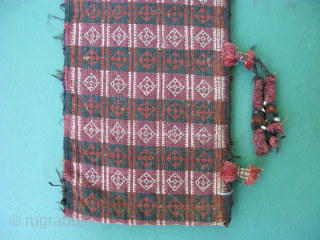 Semi-antique Baluch money bag, Pul Donneh, hand woven wool, goat hair selvage, cowrey shells, weft float brocade, both sides with pattern, Afghanistan ca. mid 20thC, general good condition with small dings, missing  ...