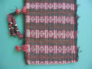 Semi-antique Baluch money bag, Pul Donneh, hand woven wool, goat hair selvage, cowrey shells, weft float brocade, both sides with pattern, Afghanistan ca. mid 20thC, general good condition with small dings, missing  ...