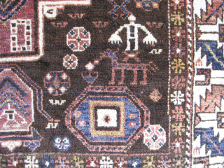 Antique Konaghend Caucasian rug, hand knotted wool on a wool foundation, Caucasus Mountains, Azerbaijan, there is a small prayer niche at the bottom, human and animal figures, signed "Aranna" on one side,  ...