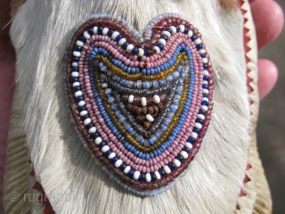 Antique Inupiat moccasins, also Inupiaq, a people of Northern Alaska, part of the Inuit Peoples, hand sewn with beaded hearts, 1st QTR 20thC, used with signs of use and soiling, the approximate  ...