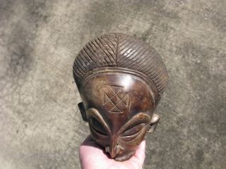 Vintage African mask, hand carved wood, Baule People, Ivory Coast, exhibiting facial scarification, a small mask like this would be used as a central feature of an elaborate mask, expanded with raffia,  ...