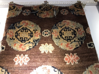 Tibetan rug, size 146*80cm. Brown color , medallion flowers . Good age.                     