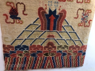 Chinese Baotou rug, size 183*107cm. The water beads spurred out from the sea water and cliffs , with lucky clouds and Buddhist 
treasures around are very beautiful. Good age excellent condition.  