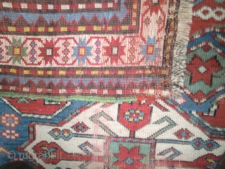 Pleasant Kazak. Good range of colours. Abrash. Interesting design. Slight losses one end, wear in the field in places and sides secured. But still bright and decorative. 199 by 100cm   