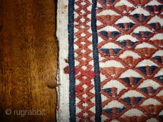 Sweet little Turkoman bag in white goat hair. All over motifs on front and back in red, rust and indigo. The second photo is the reverse. 36cm square. Couple of small repairs  ...