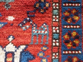 Pretty little 19th century kazak. Great colours and design. Losses to sides and edges. Couple of patches at back where rug is worn. Size 47 inches by 34.     