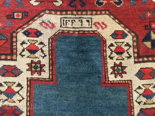 Sweet little kazak prayer rug dated 1902 or 3. Good condition. Simple and effective design. Good weave. 58 by 38 inches. Small area of repile on bottom left of the rug.  