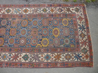 19th century Kurdish/NW Persian runner. Needs a good clean. Edges secured. Bit of a cut at one end. Some wear. Sensibly priced. Photos taken on a very bright day so a little  ...