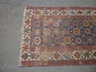 19th century Kurdish/NW Persian runner. Needs a good clean. Edges secured. Bit of a cut at one end. Some wear. Sensibly priced. Photos taken on a very bright day so a little  ...