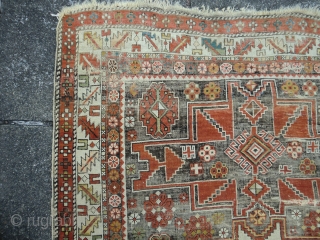 Caucasian lesghi design. Heavily corroded field. Still good enough for the floor. 126 by 164cm. Going Cheap                