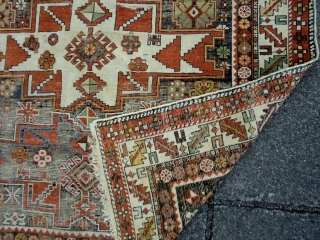 Caucasian lesghi design. Heavily corroded field. Still good enough for the floor. 126 by 164cm. Going Cheap                