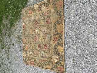Suzani in nim format. In good condition. Darker backing cloth. Subtle colours and design.                   