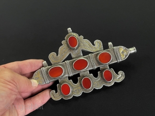 Antique Turkmen - Karakalpak Tribe Silver Tumar Pendant Fire Gilded and with Carnelian.
They use turkmen women to write the evil eye verse on the tumar box and not to touch the eye.Turkmen  ...