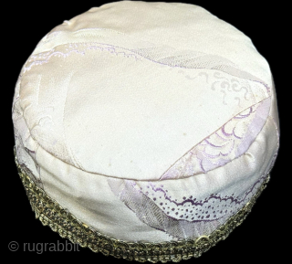 Antique traditional silk brocade and metallic embroidered child skullcap. İt has a plain cotton. İt is in great condition. Size : 2.5'' x 17'' - Height : ''7 cm x Circumference :  ...