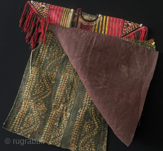 Turkmenistan - Turkmen - Tekke tribal child's silk embroidered shirt. İt is made from left over silk hand loomed fabrics and embroidered shoulder flaps with silk tassels. Nothing can be wasted in  ...