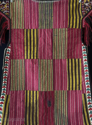 Turkmenistan - Turkmen - Tekke tribal child's silk embroidered shirt. İt is made from left over silk hand loomed fabrics and embroidered shoulder flaps with silk tassels. Nothing can be wasted in  ...