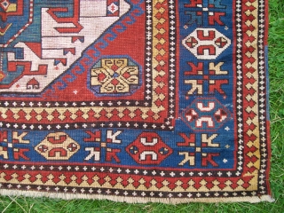 Triple-medallion Kazak rug, West Caucasus. Circa 1880. [215x141 cm] or [7'1"x4'7"] All wool with beautiful saturated colours. Good condition with a few small repiled areas. Top collector's item.     