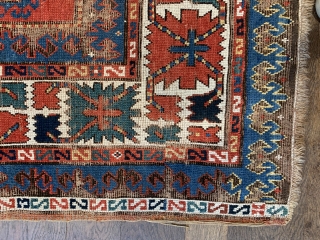 Pre commercial kazak probably mid 19 c with unusual design and the saturated natural dyes we would expect from that age. 
Size 232 x 136. Hand washed old repairs to corroded brown  ...