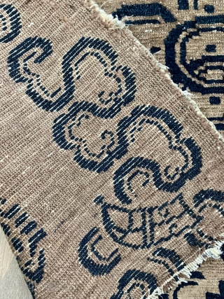 AntiquecTibetan rug with good age ca1880 or before.  the double squares are Chinese double lozenges(Fangsheng) and the two circles, double coins( Shuangqian), and not so sure about the top right motif  ...