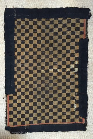 Nice genuine antique Tibetan chequerboard rug early 20 c.
Cute small size remnants of synthetic red borders to all four sides.
Needs backing properly but has great movement       