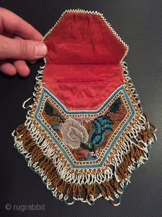 Charming antique American Indian beadwork purse the finest of this type I have seen.
Late 19 c in excellent condition including the satin lining with small pocket       