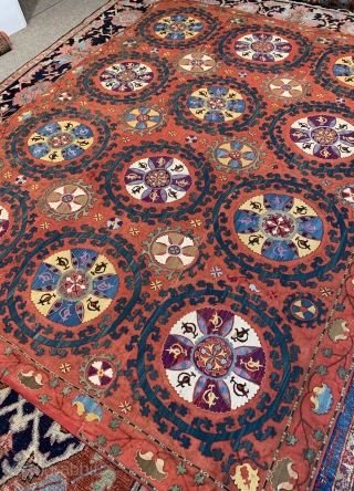 A large antique Suzani embroidery on red cotton ground ca 1880 size 256 x 191 cm
Professionally backed some details fuchsine unusual and decorative          