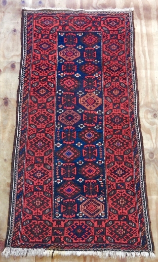 Antique Mina-Khani Baluch rug with character. A good 100-year-old piece with all natural dyes and deep corrosion of black wool rendering good relief and thus a sculptured effect to the field and  ...