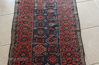 Antique Mina-Khani Baluch rug with character. A good 100-year-old piece with all natural dyes and deep corrosion of black wool rendering good relief and thus a sculptured effect to the field and  ...