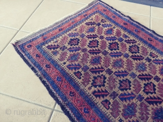 Antique Camel ground Baluch. Not a very common form of the ashik gul found in Baluch rugs. Nice grid work and notice how the arrows inside the guls point in one direction.  ...