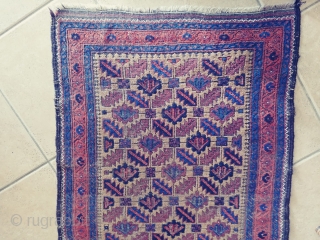 Antique Camel ground Baluch. Not a very common form of the ashik gul found in Baluch rugs. Nice grid work and notice how the arrows inside the guls point in one direction.  ...