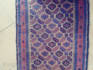 Antique Camel ground Baluch. Not a very common form of the ashik gul found in Baluch rugs. Nice grid work and notice how the arrows inside the guls point in one direction.  ...