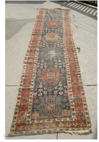 Early NW. Persian runner. Could use a cleaning and repair but well worth it. It measures approximately 13.5feet x 3feet.             