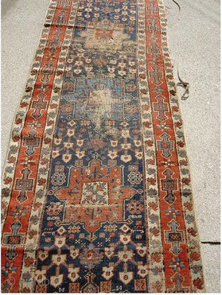 Early NW. Persian runner. Could use a cleaning and repair but well worth it. It measures approximately 13.5feet x 3feet.             