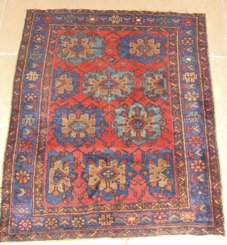 An Unusual Afshar with a very tribal feel. It had been cut for some reason near the center of the field. It measures about 43" x 54"      