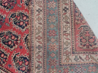 I believe this Kurd runner to be of the late 19th century. The soft rosy red background of the field and the soft light blue main border with its flanking white minor  ...
