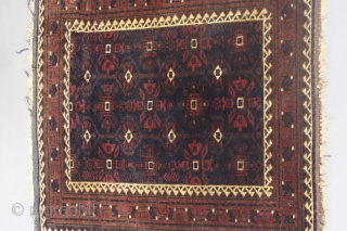 Square antique Baluch bagface with silk. I do not recall seeing bags with this  design having a running dog border nor could I find any in my library. Measures 2.3 inches  ...