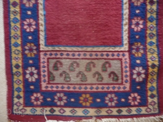 KHOTAN ;  An unusual Khotan prayer rug, complete and in reasonable condition.
SOLD                    