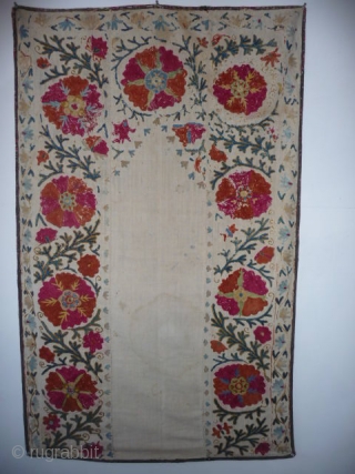 A very pretty small prayer suzani, 4ft5in x 2ft9in.,late 19th cent., embroidery a little rubbed at the top,slight run from the cochineal in a couple of flowers, sound with attractive printed backing,water  ...