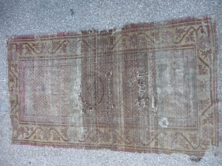 Ancient ethereal Khotan rug with an unusual design, complete and in ghostly condition.                    