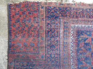 An ancient and venerable blue field Timuri prayer rug. Inky black field with polychromatic light blue and green. Low pile faded old repairs etc. Beautiful old rug. 4ft10ins. x 4ft   